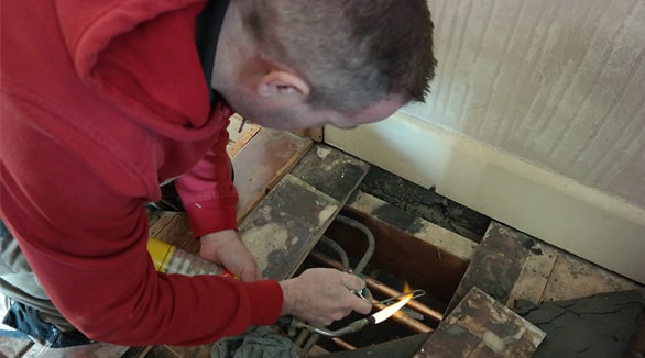 One of our skilled plumbers in action.